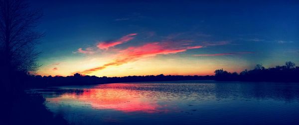 Scenic view of lake at sunset