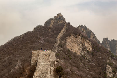 Rock formations on mountain against sky