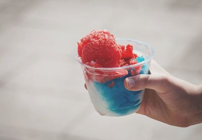 Close-up of hand holding ice cream