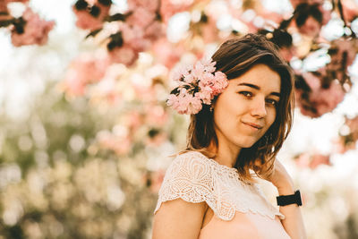 Portrait of beautiful woman with flowers