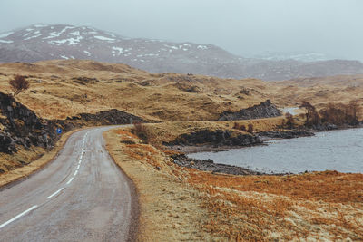 Road amidst landscape against sky