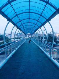 Rear view of man on footbridge