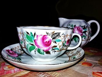 Close-up of multi colored flower in plate on table