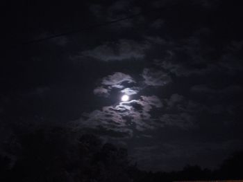 Low angle view of moon in sky at night