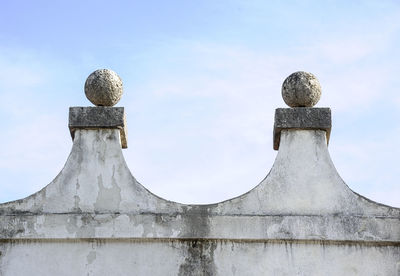 Low angle view of statue against sky