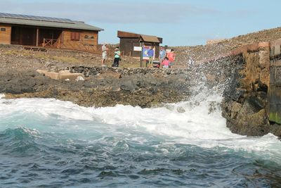 Water flowing through rocks in sea