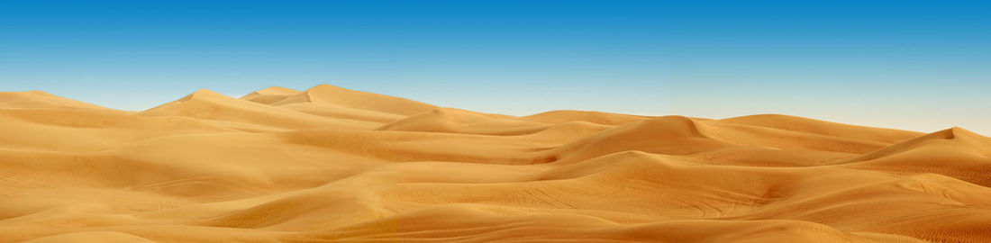 Scenic view of desert against clear sky