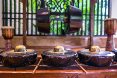 Close-up of tea candles on wood