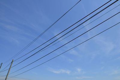 Low angle view of wires against sky