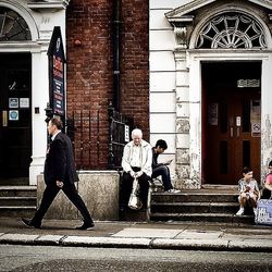 Full length of woman standing in front of building