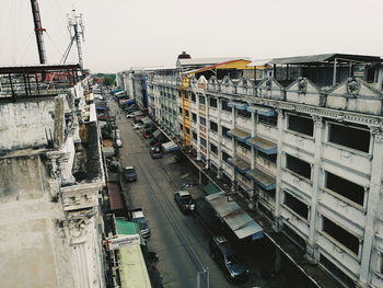 High angle view of vehicles on road against sky