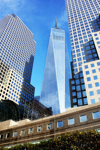 Low angle view of modern buildings against sky