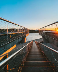 High angle view of steps against clear sky at sunset
