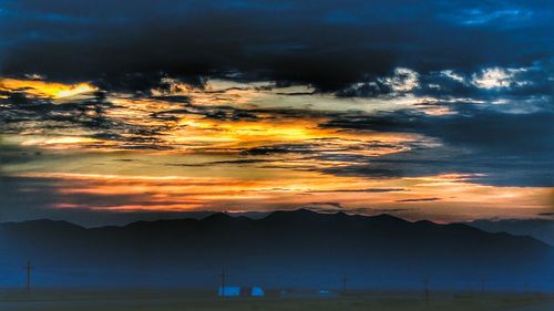 Scenic view of dramatic sky during sunset