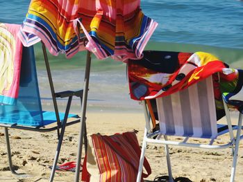 Multi colored chairs on beach