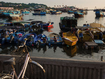 Boats moored at harbor