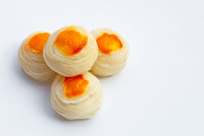 High angle view of orange slices on white background