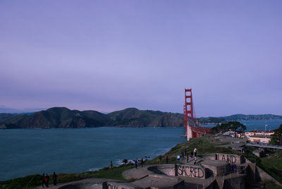 Scenic view of sea and buildings against sky