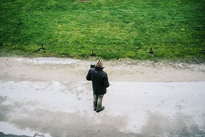 Full length of woman standing by railing