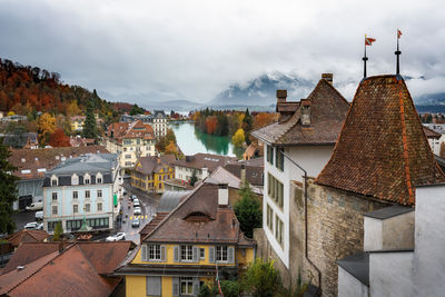 Buildings in town against sky