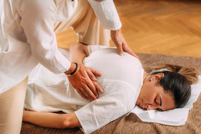 Shiatsu hand massage. therapist activating the heart meridian.