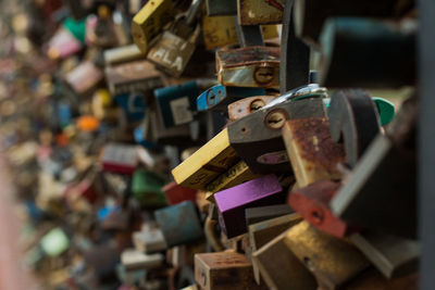 Close-up of padlocks hanging on metal