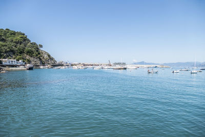 Scenic view of sea against clear blue sky