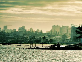 Scenic view of cityscape against sky during sunset