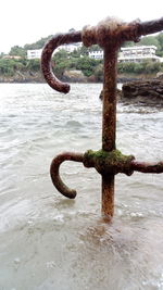 Close-up of padlock on metal