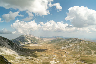 Panoramic view of landscape against cloudy sky