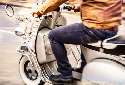 Low section of man on motorcycle