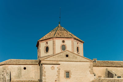 Low angle view of building against blue sky