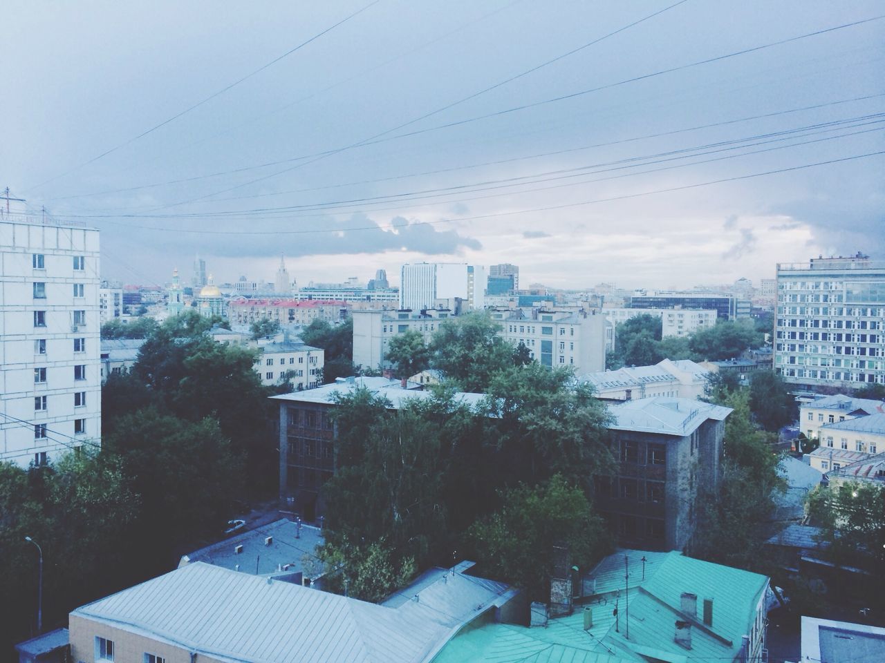 building exterior, architecture, built structure, city, residential building, residential structure, residential district, sky, power line, cityscape, house, tree, high angle view, building, cable, day, crowded, city life, electricity pylon, outdoors