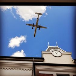 Low angle view of clock tower against sky