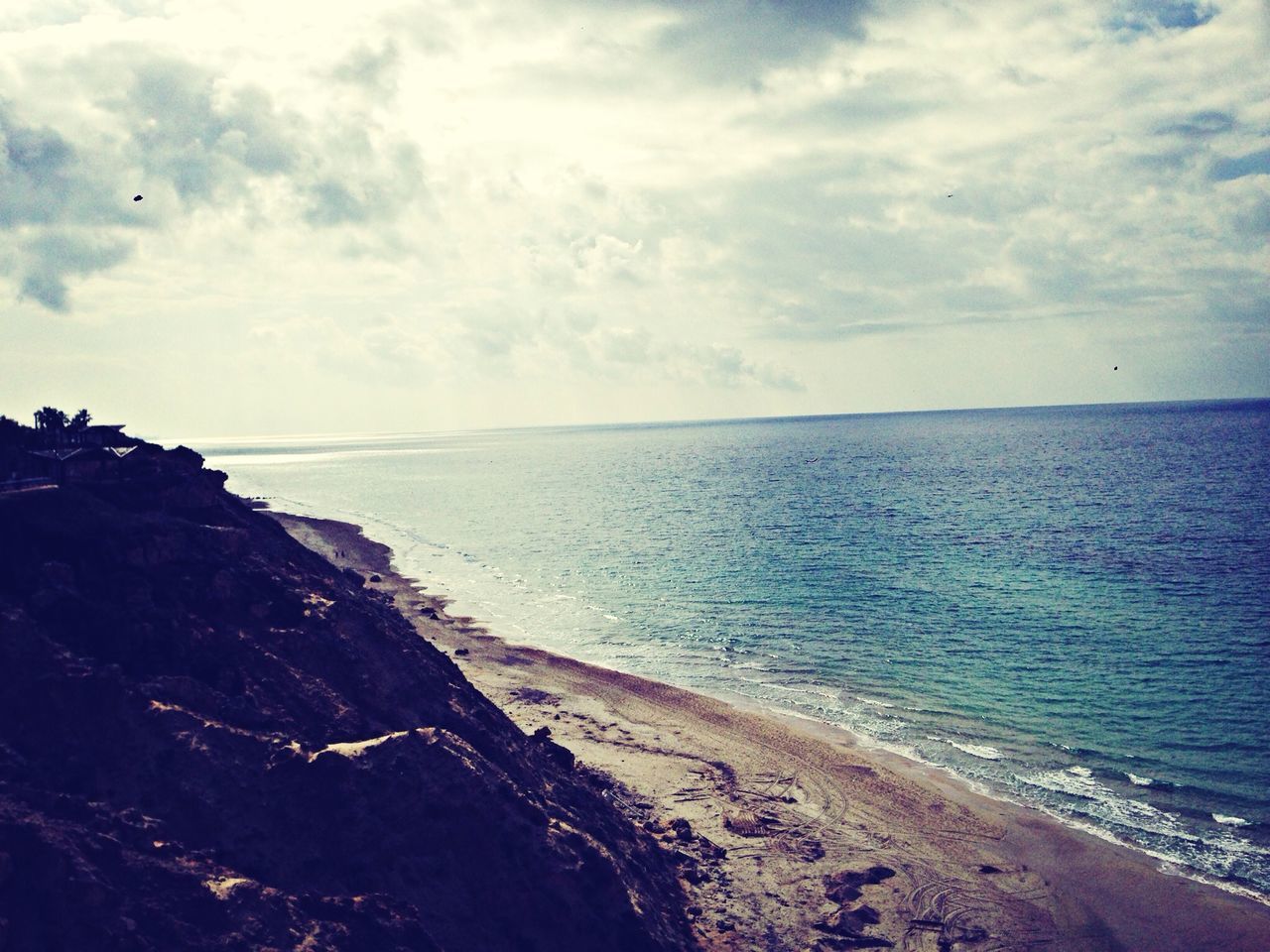 sea, horizon over water, water, beach, sky, tranquil scene, scenics, tranquility, beauty in nature, shore, nature, cloud - sky, sand, idyllic, coastline, cloud, wave, seascape, cloudy, remote