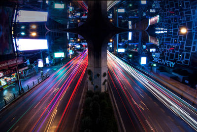 High angle view of light trails on road at night