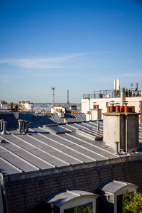 High angle view of buildings against blue sky