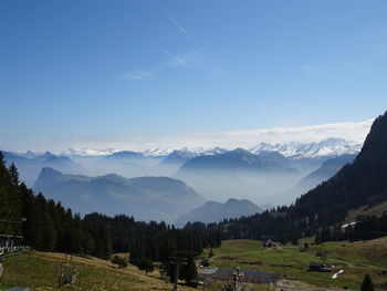 Panoramic view of trees and mountains against sky