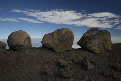 Low angle view of rock formation against sky