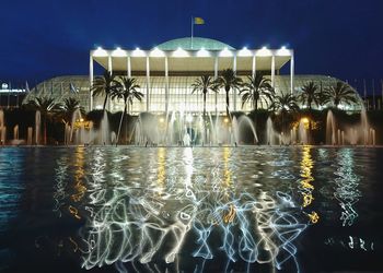 Fountain in swimming pool at night