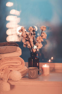 Close-up of illuminated candles on table