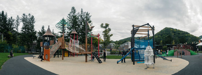 Panoramic view of amusement park against sky