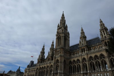 Low angle view of cathedral against cloudy sky