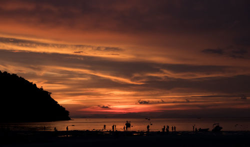 Scenic view of beach against sky during sunset