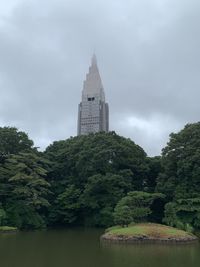 View of temple building against cloudy sky