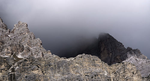 Rocks in mountains against sky