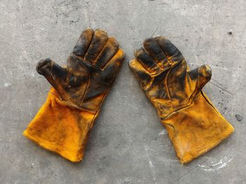 High angle view of dirty gloves