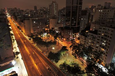 High angle view of illuminated city buildings at night