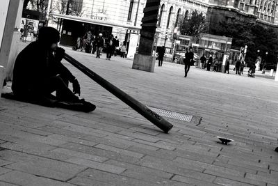 High angle view of man sitting outdoors