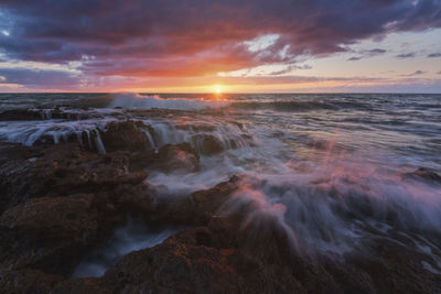 Scenic view of sea against sky during sunset